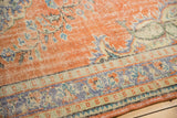 Textured distressed Oushak carpet revealing foundation, pale brick red, blue, sea foam green motifs.