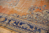 Distressed Oushak carpet border with faded brick red, navy blue, and antique ivory Rococo vinery.