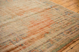 Distressed vintage Oushak rug, prominent textural wear revealing apricot and mint colors.