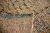 Distressed Oushak hand-knotted pile texture, showing wear to knot heads in apricot, mint, ivory.