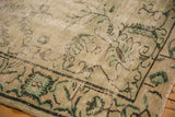 Distressed vintage Oushak corner, Arts & Crafts inspired pale green tendrils on border.