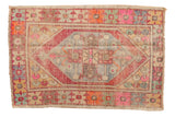 Vintage distressed Oushak rug: geometric lozenge medallion, playful purple, orange, and blue. 2'8