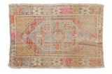 Distressed Oushak rug with geometric medallion, vibrant pink, terra cotta, and sand hues, 2'5