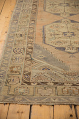 Vintage Distressed Oushak runner's worn lower border, featuring muted beige and silver geometric patterns.