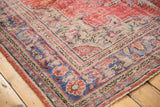 Distressed vintage Oushak rug border pattern in cherry red, dusty navy blue, and ivory.