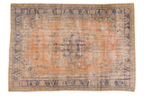 Vintage Distressed Oushak rug, apricot field with faded navy floral vinery medallion, 6'9