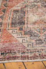 Hand-knotted distressed Oushak rug texture, showing even wear, brick red, charcoal, and beige.