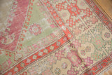 Wide banded border with hook and latch motifs in tangerine, raspberry, and seafoam green.