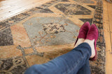 Distressed vintage Oushak runner, central medallion with visible knot wear and faded rust.