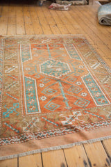 Distressed Turkish Melas rug featuring madder root rust, sky blue geometric pattern, and even wear.