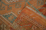 Reverse and pile of distressed Turkish Melas rug with painted numbers and madder rust motifs.