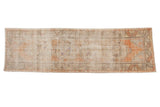 Distressed Oushak runner with worn apricot medallions and an abrashed field, 2'10