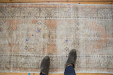Abrashed texture of vintage Oushak runner with worn dusty apricot, beige, and pale blue.