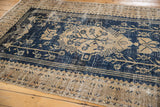 Distressed vintage Oushak carpet, dark navy and antique ivory tree of life motif.