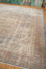 Textured wear and abrash revealing foundation on a distressed vintage Oushak rug with pale rust border.