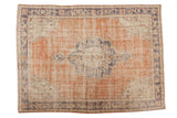 Distressed Oushak carpet, central scalloped medallion, abrashed rust, navy, ivory hues, 5'7