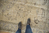 Distressed vintage Oushak texture with faded vinery motifs and areas of visible foundation.