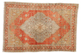 4x6 Vintage Oushak rug with a faded diamond medallion in terra cotta, silver, and beige.