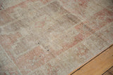 Faded geometric relief and abrashes in antique ivory and pale coffee brown on this Oushak runner.