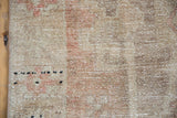 Distressed pile of vintage Oushak runner showing fantastic abrashes, ivory, and faded chestnut.