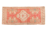 Distressed Oushak rug mat runner with pink, ivory serrated medallion, 1'7
