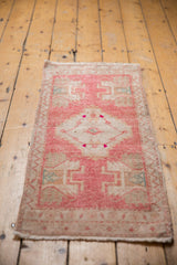 Distressed pink blush Oushak runner corner, low pile with ivory geometric border and fringe.