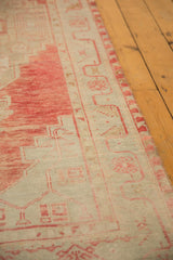 Distressed Oushak runner texture, showing even wear on blush and ivory knot heads.