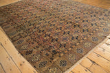 Vintage Turkmen carpet corner with fringe, unique pomegranate border, and chestnut Bokhara guls.