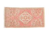 Distressed hand knotted Oushak rug mat, pale blush pink, ivory geometric medallion.
