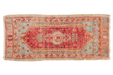 Distressed Oushak runner with cherry red, aqua, and central medallion, 1'10