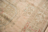 Even wear to knot heads and soft blush, rose, silver tones on the Oushak rug pile.