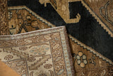 Hand-knotted backing of a distressed Northwest Persian rug, with serrated leaf border visible.