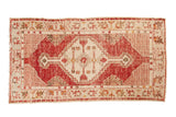 Cherry red distressed Oushak rug runner with a serrated medallion and antique ivory field, 2'8