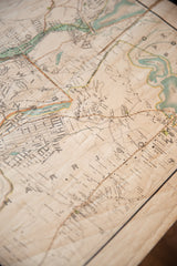 Angled view of an antique Westchester map showing fine cartography and aged, textured paper.