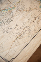 Angled detail of the antique Westchester map showing property plots and aged paper texture.