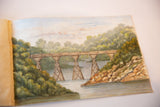 Antique English landscape watercolor of a railway bridge and green hills, laid open in a portfolio.