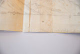 Antique pencil sketch detail: aged, folded paper with handwritten 