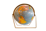 Vintage 1960s Cram's Scholastic globe, blue oceans, colorful landmasses, brass axis, 12 inches.