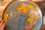 Vintage 1960s Cram's globe showing Central and Southern Africa's soft land colors.