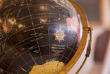 Cram's Universal Terrestrial Globe 10.5-inch label on the aged black surface.