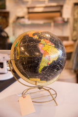 Cram's black globe's brass Mid Century Modern base with blank tag.