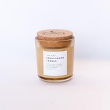 Slow North Sandalwood Amber candle with cork lid and white label.