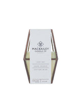 Geometric copper lantern candle with pale soy wax and Macbailey brand label.