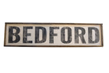 Old-fashioned farm stand style wooden sign, distressed black letters, dark frame.
