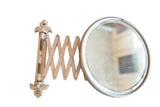 Antique white shaving mirror with fleur de lis hardware, patina, and accordion extension.