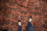 Vintage Mahal carpet with allover cherry red, navy, and ivory palmette design, showing varied pile texture.