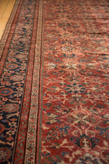 Vintage Mahal carpet: cherry red palmette field, geometric, and navy blue floral borders.