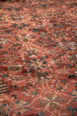 Cherry red vintage Mahal carpet pile detail: blue palmettes, floral vinery, light foundation.