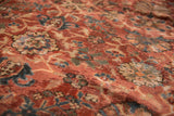 Blush, navy, and ivory palmette design on vintage Mahal carpet's low pile surface.