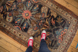 Antique Kurdish Bijar rug: oversized navy, blush, green motifs, showing even wear and foundation.